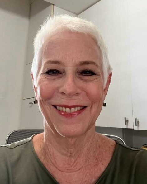 portrait photo of Susan. She is smiling as she looks straight into the camera. Photo courtesy of the artist.