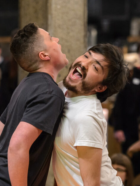 Performance shot from When I Say I Love You, 2014 - Performed at the Whitney Museum Biennial, New York, NY. Two performers standing chest to chest. They both have big smiles. Photo courtesy of the artist.