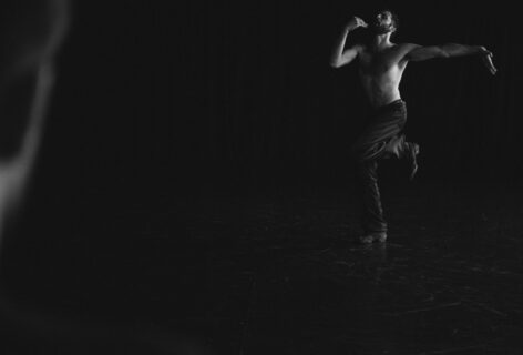 Dancer wearing black pants and shoes in various movement positions. The photos are in black and white. Photo by Sebastian Bauer