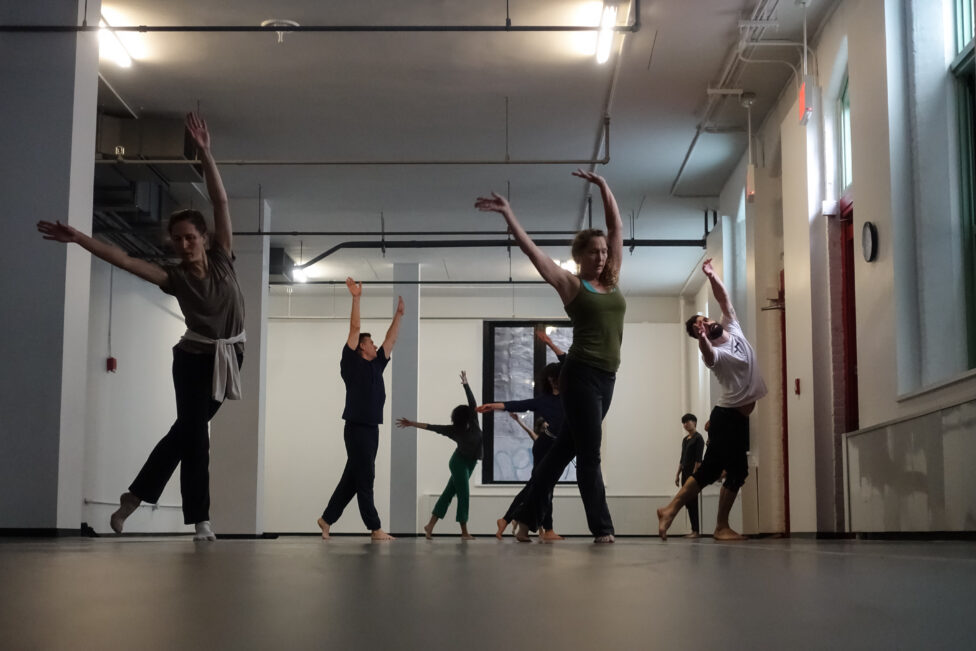 2019.10.11, Jon Kinzel.Photo by Harry Shunyao Zhang. Photo of dancers moving around the studio during Jon Kinzel’s class. They cross their legs while moving and reach their arms up and diagonally. Photo by Harry Shunyao Zhang.