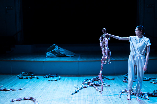 Leah holding up a doll, looking at it. By Diego Quintanar (Trooper’s Brother), Leah Ogawa in Trooper’s Brother.